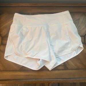 White LuluLemon shorts with mesh siding size 10